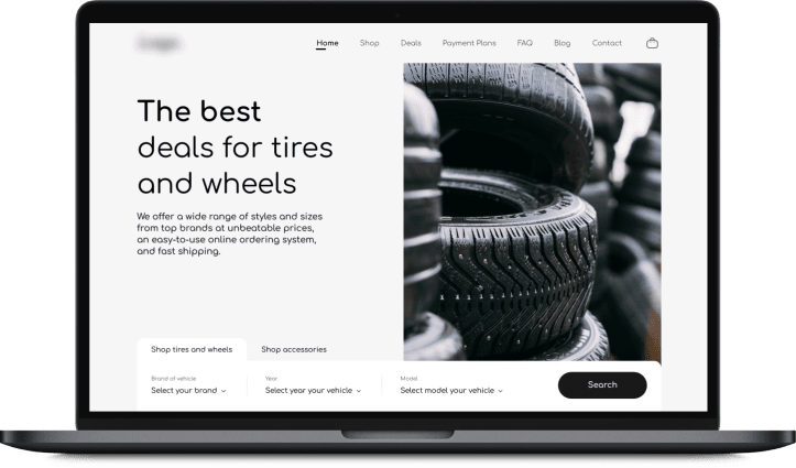 Laptop displaying a tires and wheels e-commerce homepage with a large headline, navigation menu, search filters for vehicle brand, year, and model, and a close-up promotional image of stacked tires.